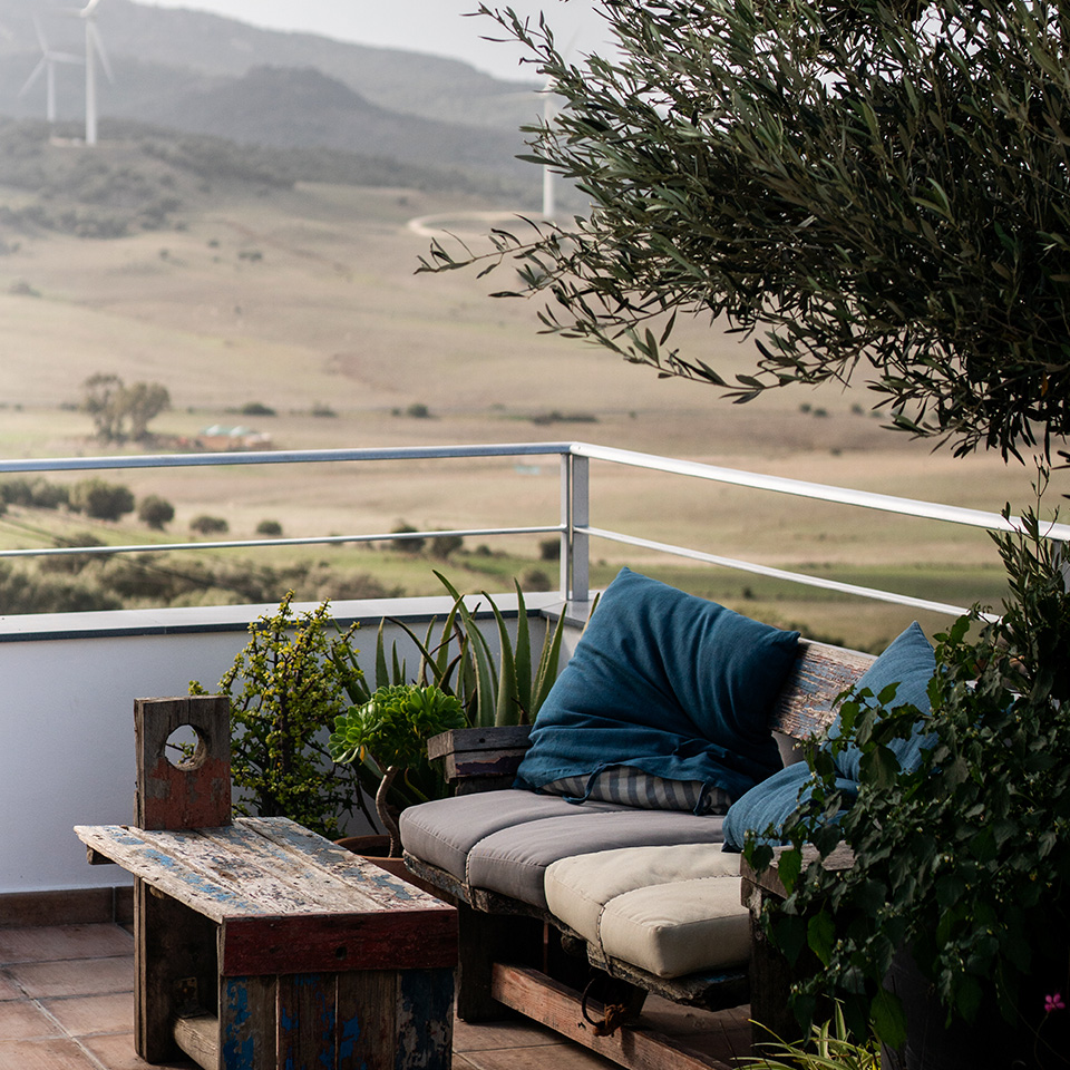 Rustic wooden sofa overlooking the countryside