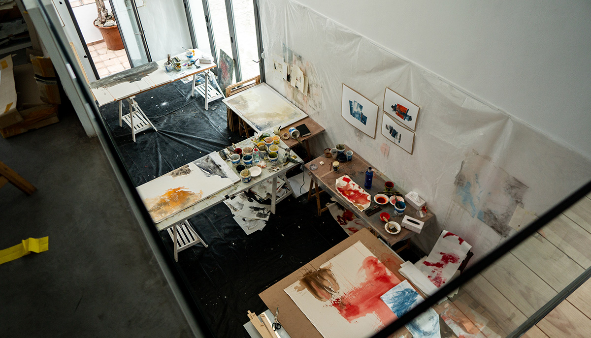 Aerial view of the workshop with tables with paintings
