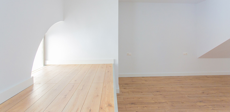 Wooden decking at home with white walls