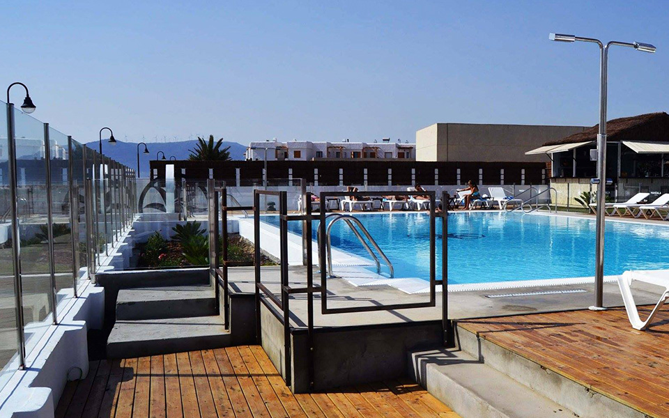 Outdoor pool with sun loungers and snack bar