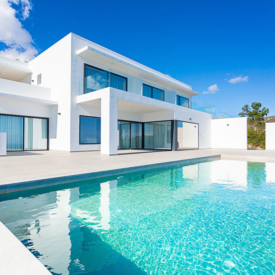 Mediterranean-style white detached house with windows and pool